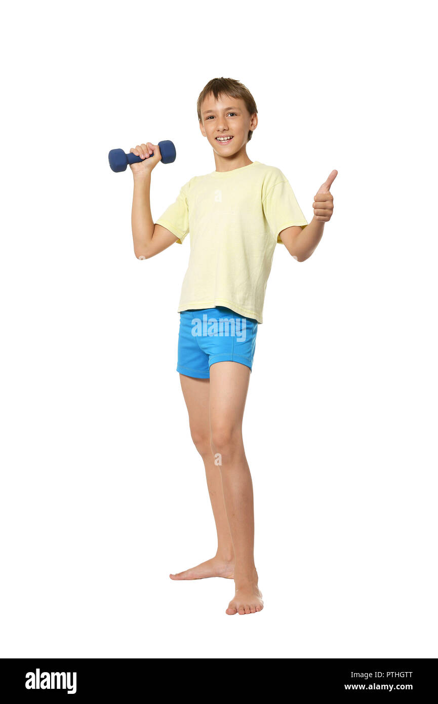 Portrait d'un jeune garçon faisant des exercices sur fond blanc Banque D'Images