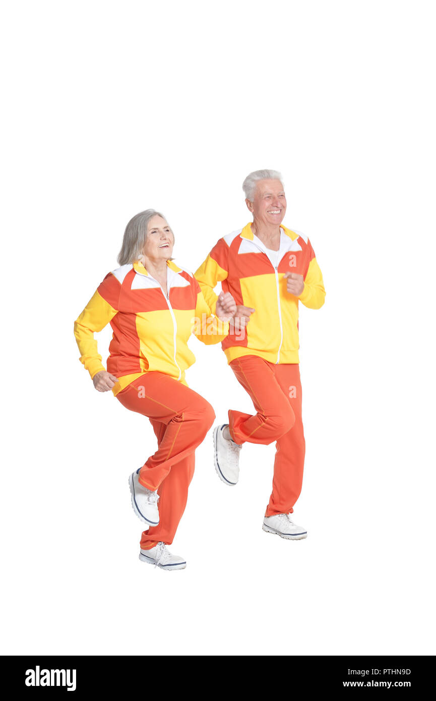Portrait de senior couple exercising isolated on white Banque D'Images
