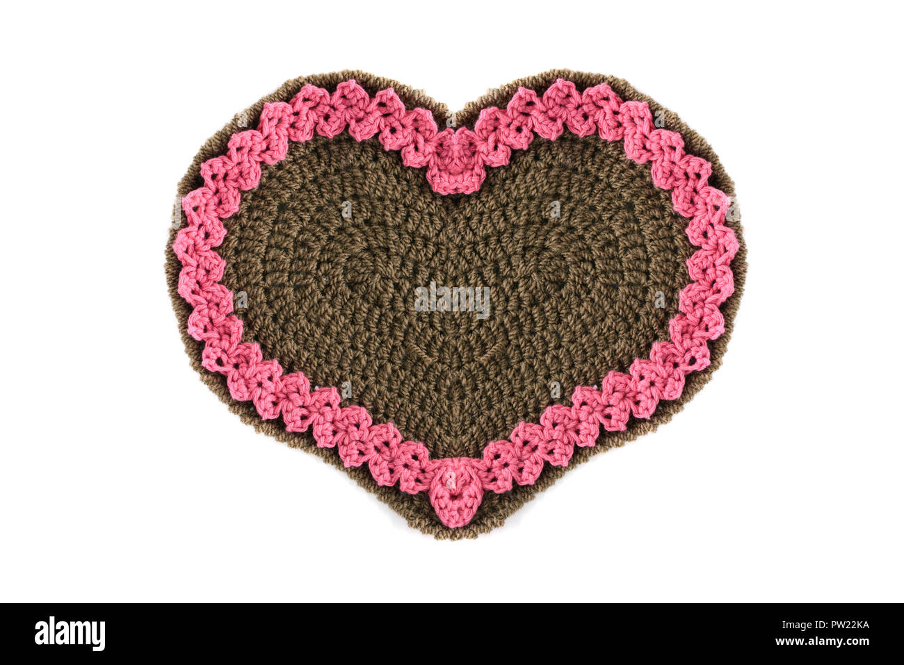 Crochet en forme de coeur d'Épices cadeau saint valentin avec copie espace blanc sur fond isolé. Banque D'Images