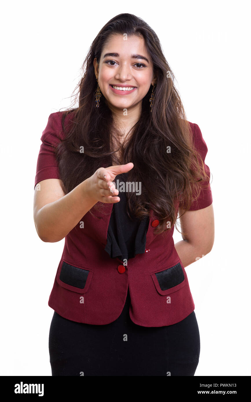 Young happy Indian businesswoman smiling tout en donnant handshake Banque D'Images