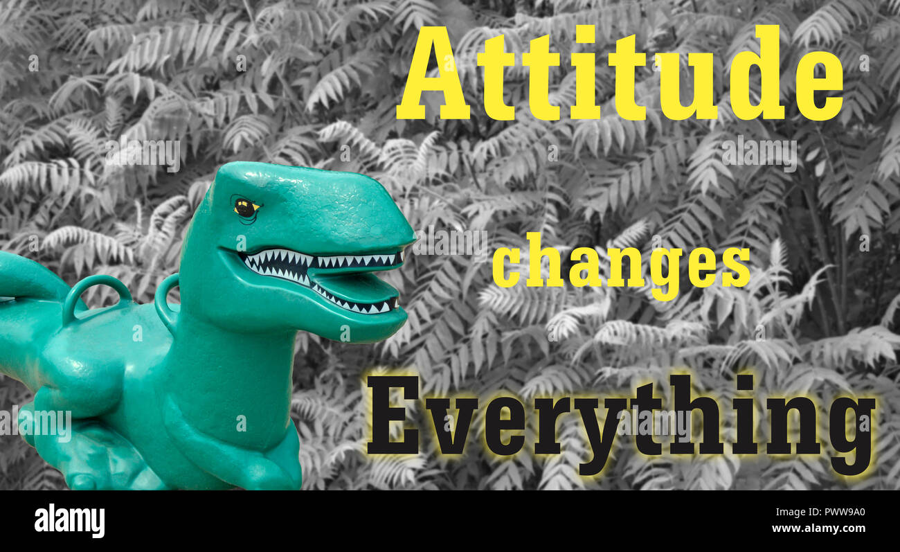 Petit jouet Dino T-Rex à l'aide d'Attitude Change tout slogan Banque D'Images