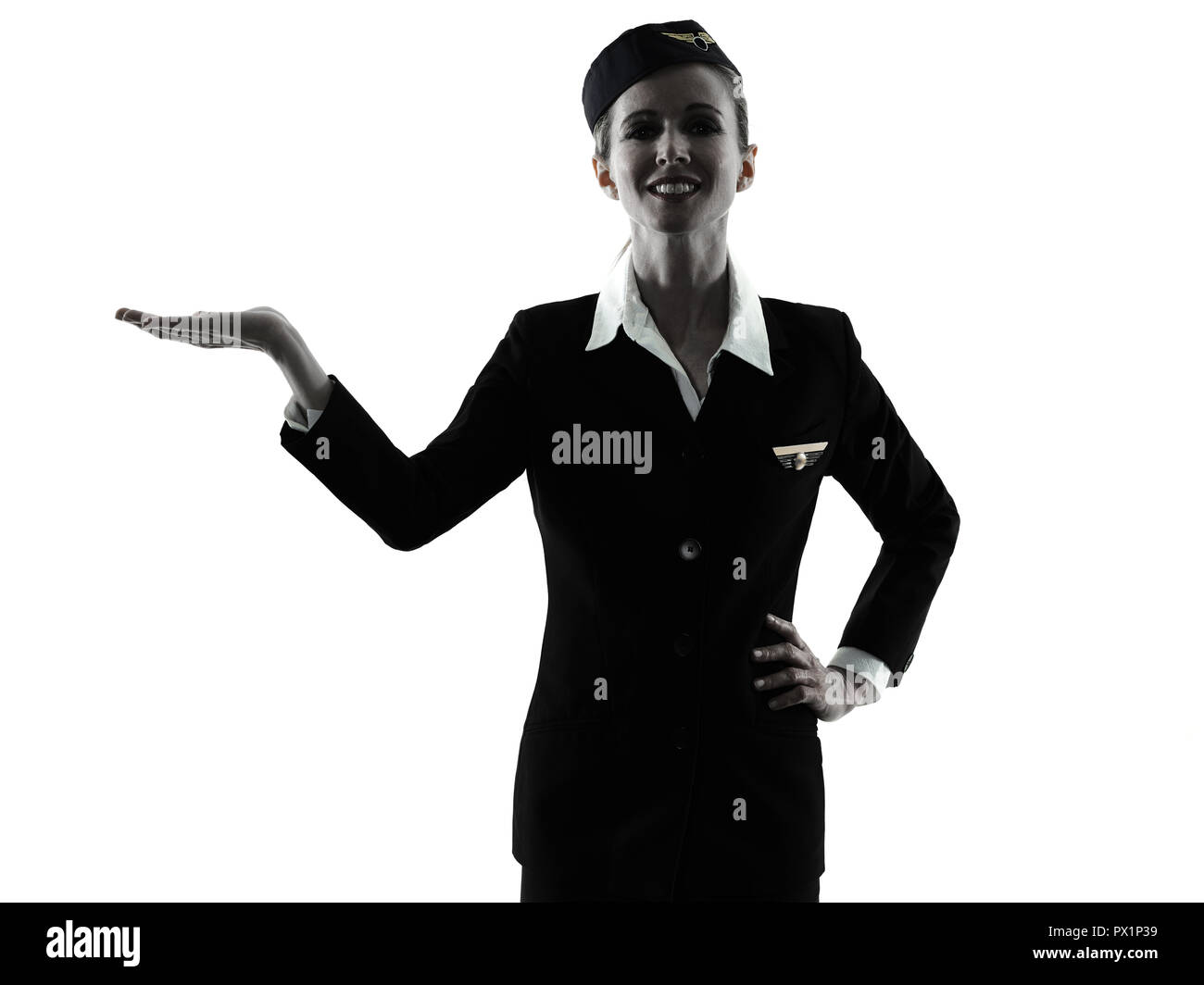 Une hôtesse de l'équipage de cabine de race blanche femme les mains ouvertes isolé sur fond blanc en silhouette Banque D'Images