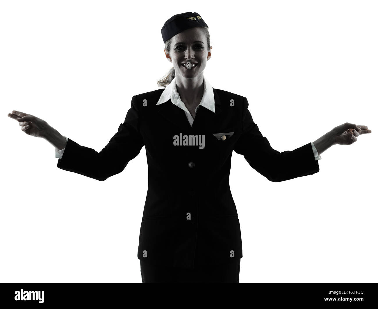 Une hôtesse de l'équipage de cabine du Caucase woman pointing montrant isolé sur fond blanc en silhouette Banque D'Images