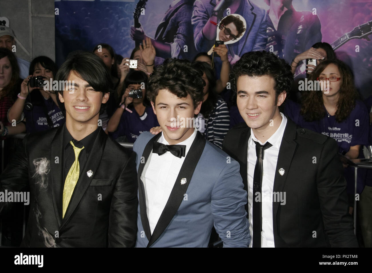 The Jonas Brothers, Nick Jonas, Joe Jonas and Kevin Jonas and little brother  Frankie Jonas The New York Premiere of the Disney Stock Photo - Alamy