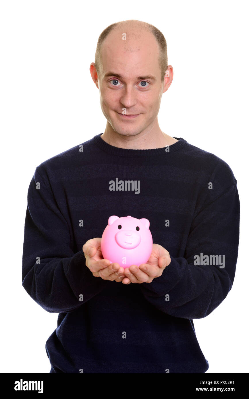Close up of bald man holding piggy bank Banque D'Images