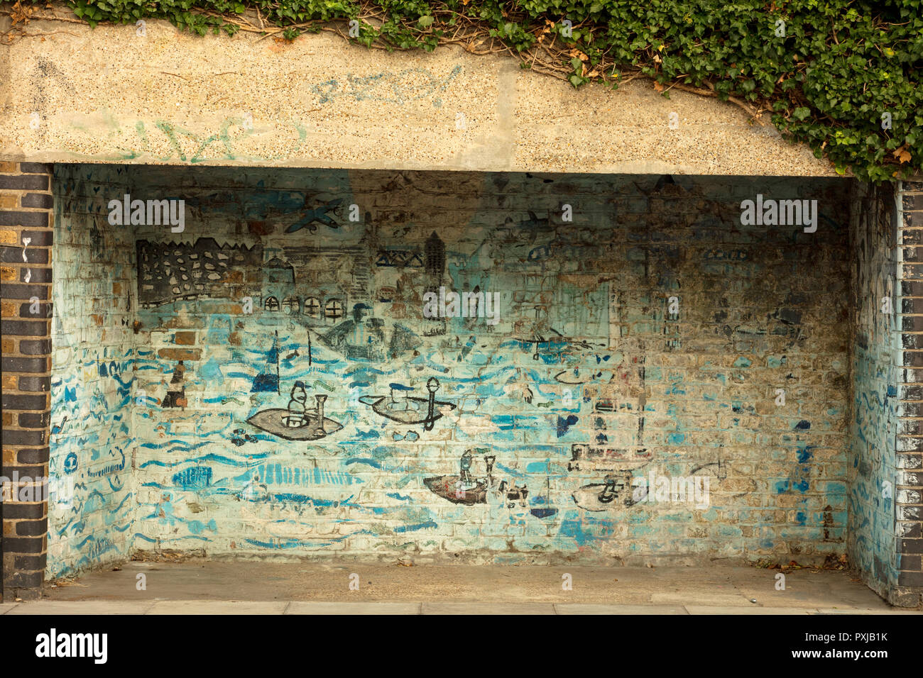 Gros plan des griffeaux et des graffiti vus sur le mur de Londres. Banque D'Images