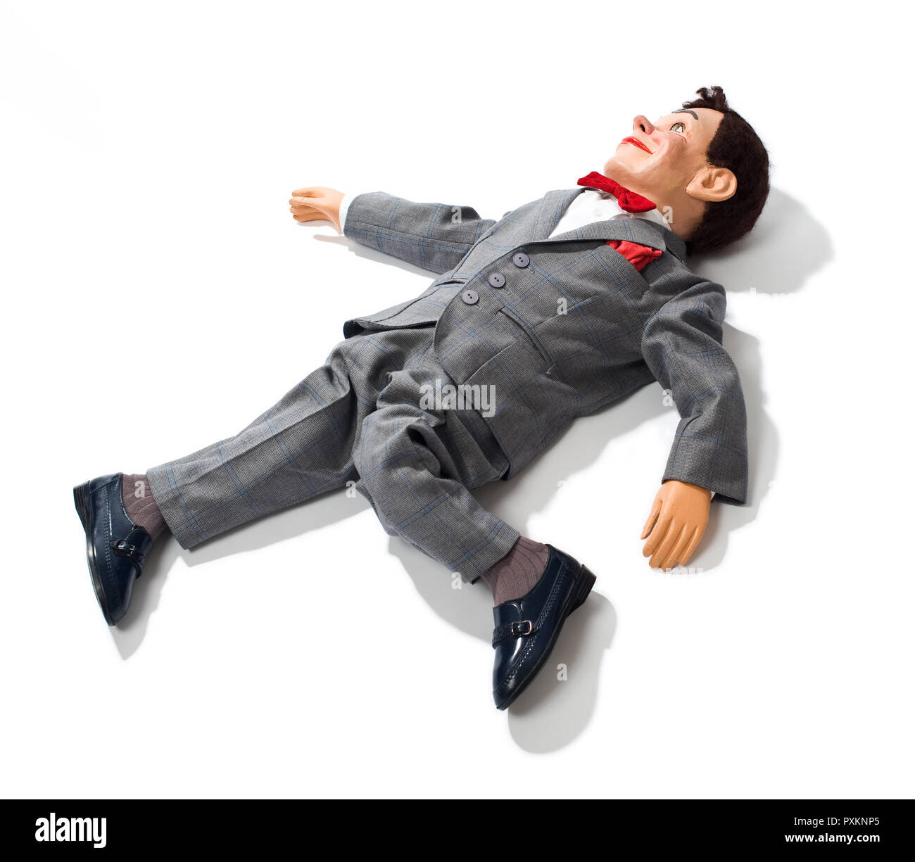 Un mannequin ventriloquiste posé sur le sol Banque D'Images