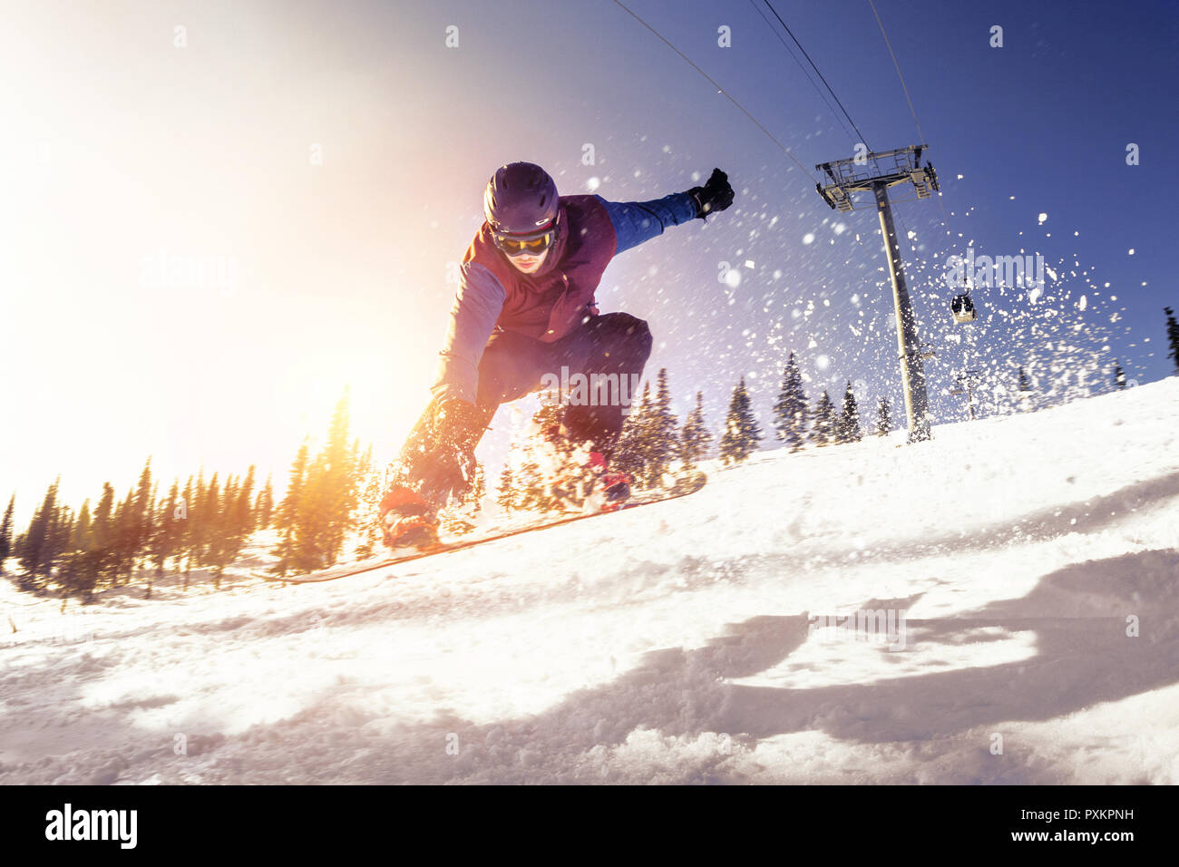 Snowboard concept avec jumping snowboarder à pente de ski Banque D'Images