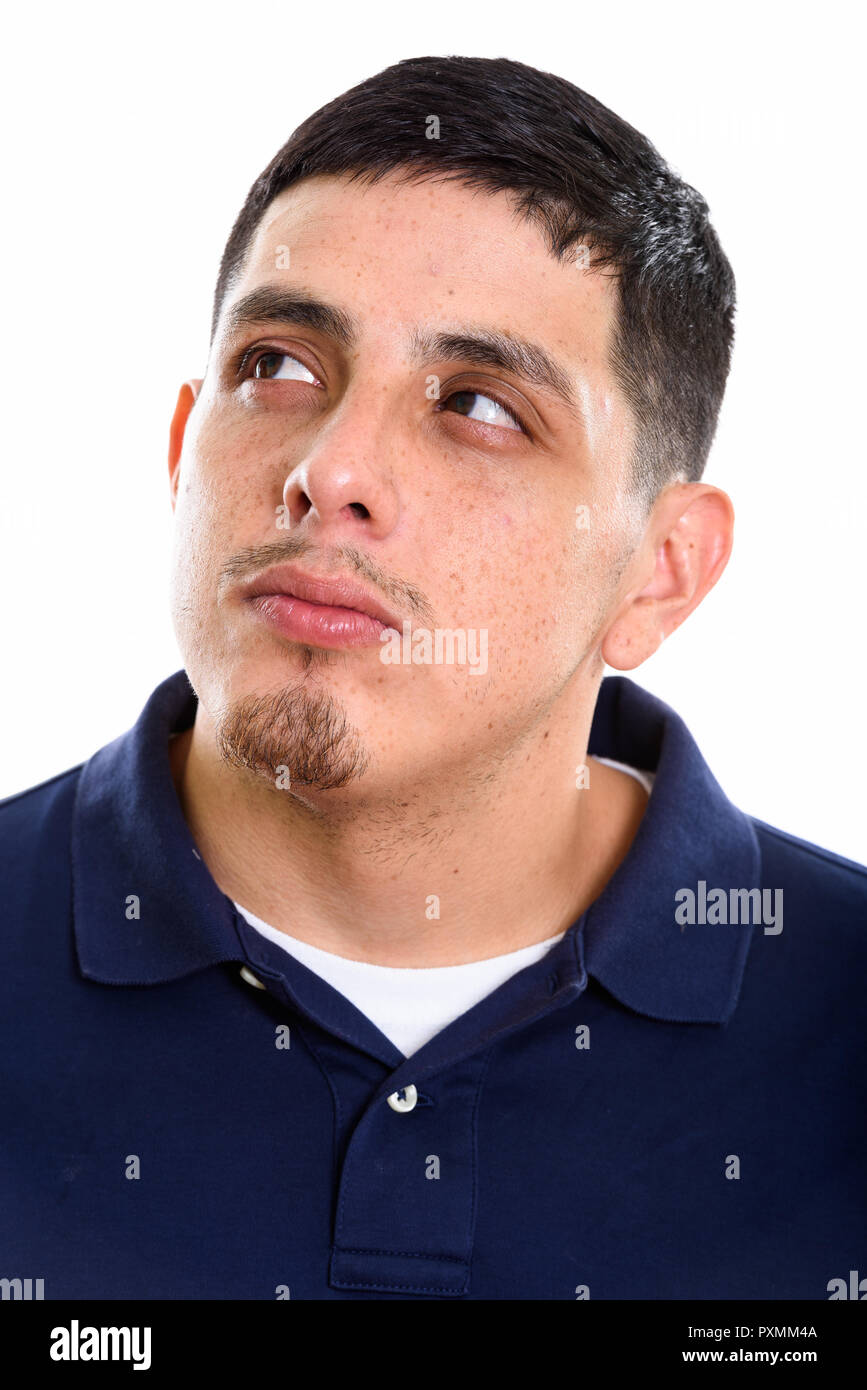 Face of young man thinking while looking up Banque D'Images