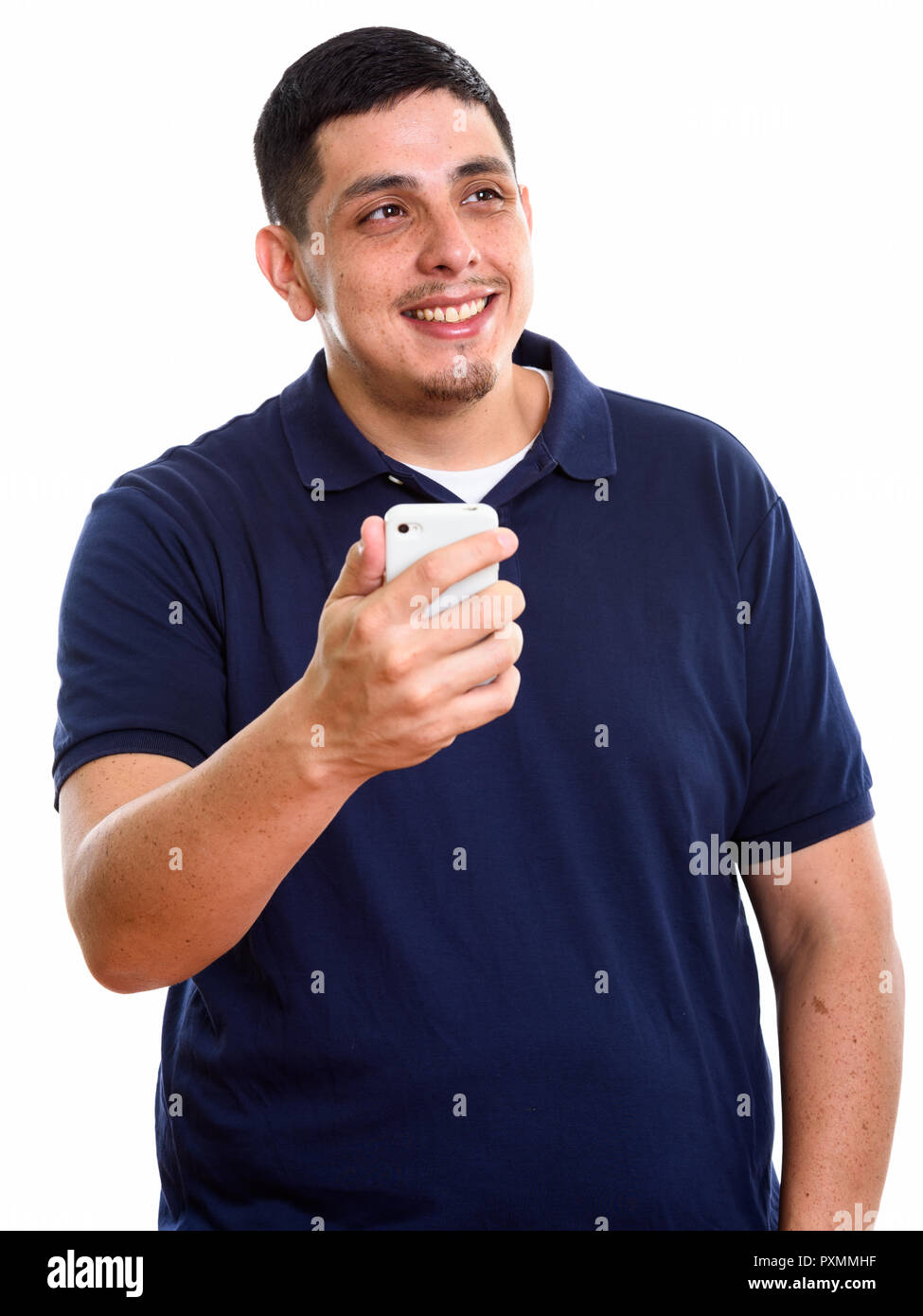 Young happy Senior man smiling while holding mobile phone Banque D'Images