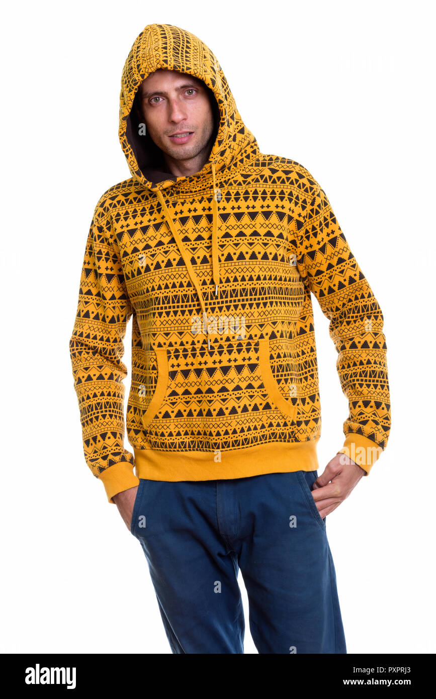 Studio shot of young handsome man standing while wearing hoodie Banque D'Images