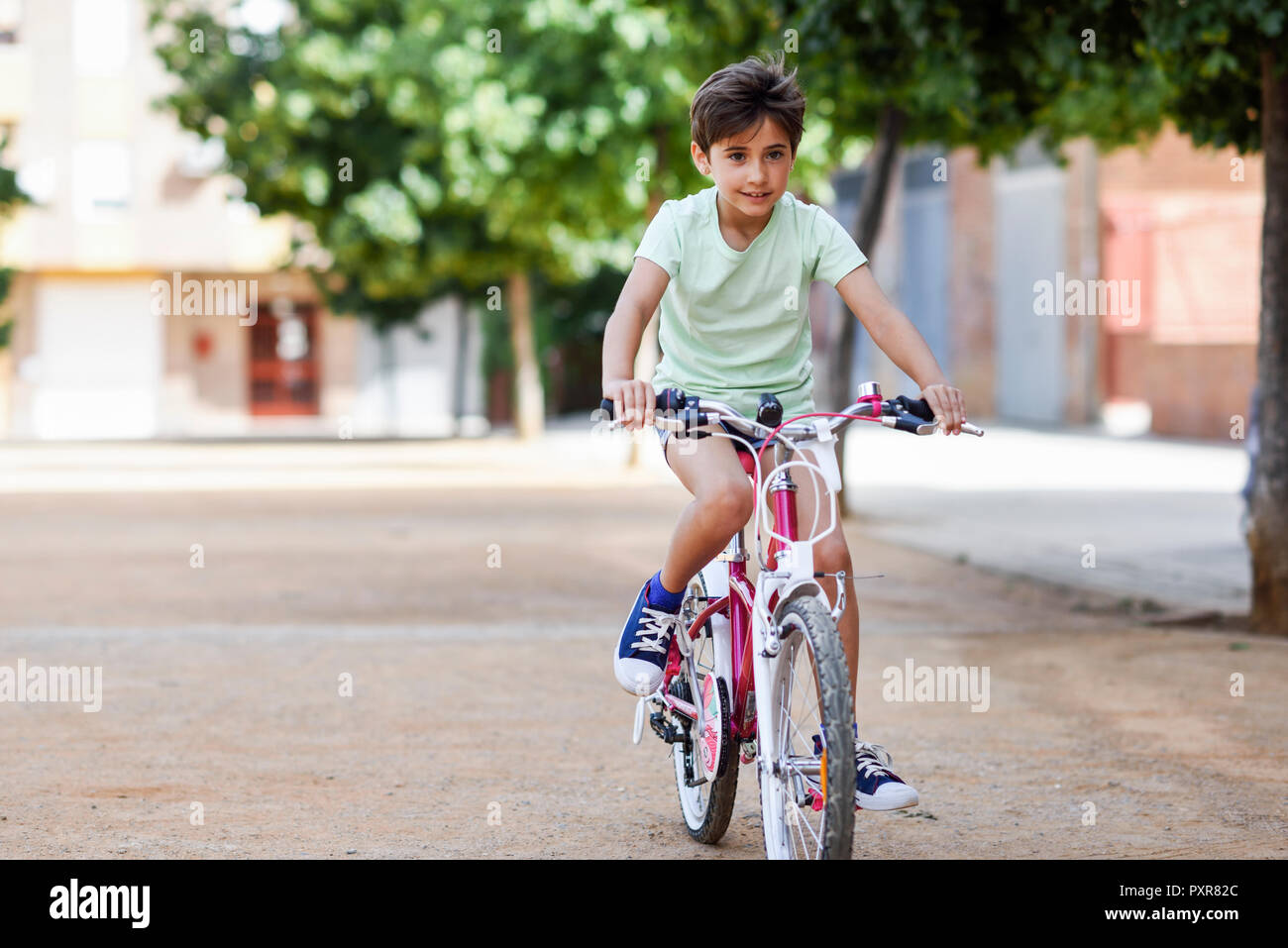 Portrait of little girl riding bicycle Photo Stock Alamy