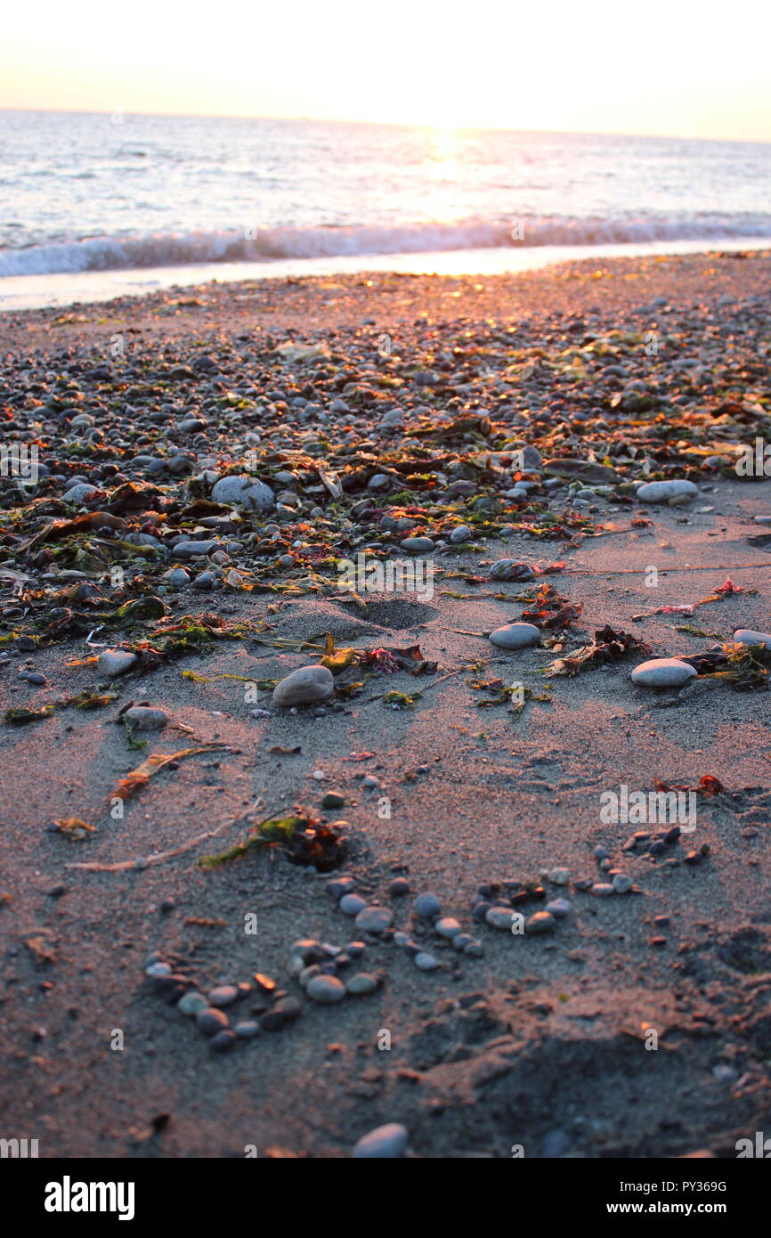 Crois message sur la rive de la plage Banque D'Images