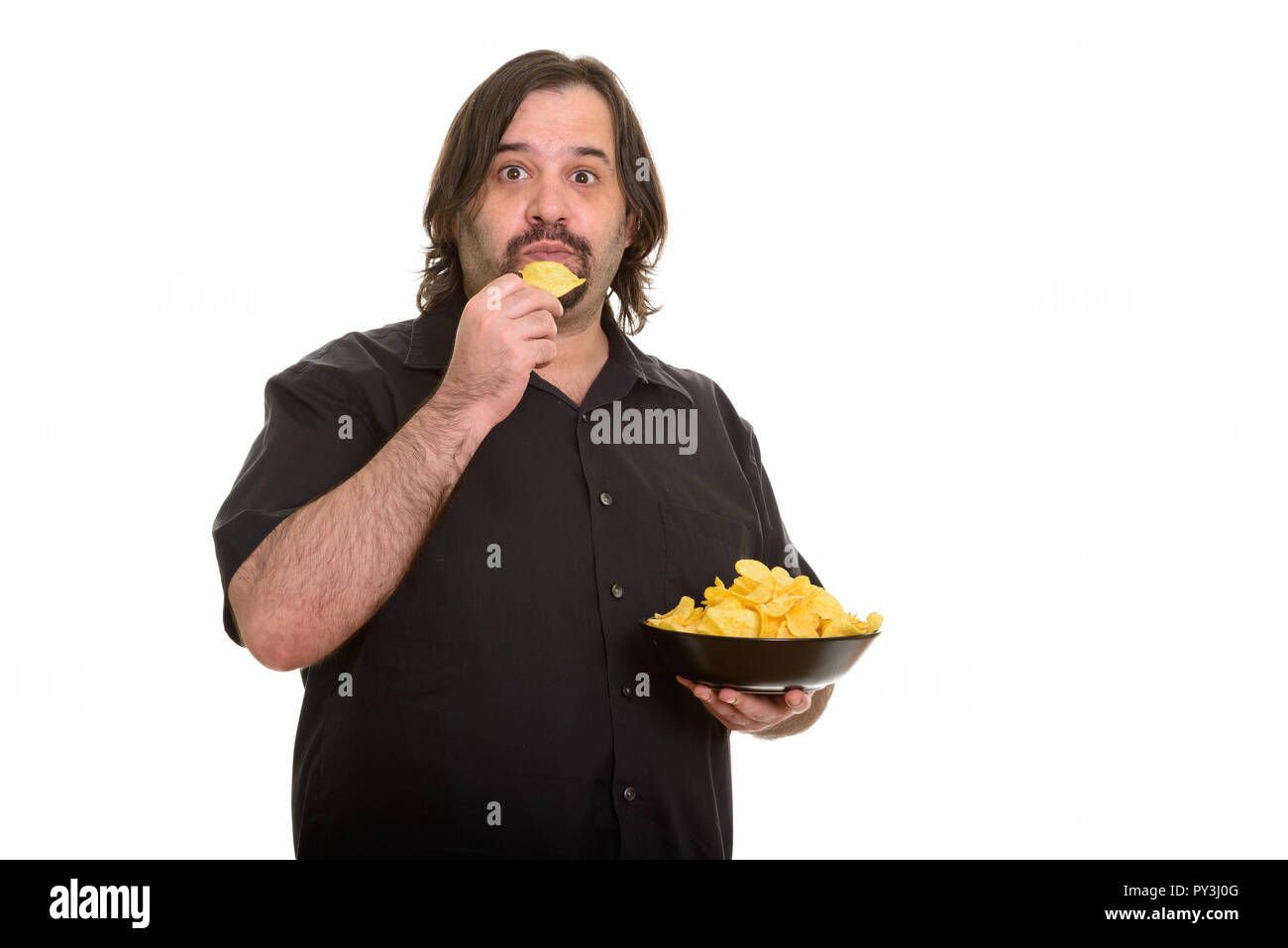 Fat Man eating bowl de jetons Banque D'Images