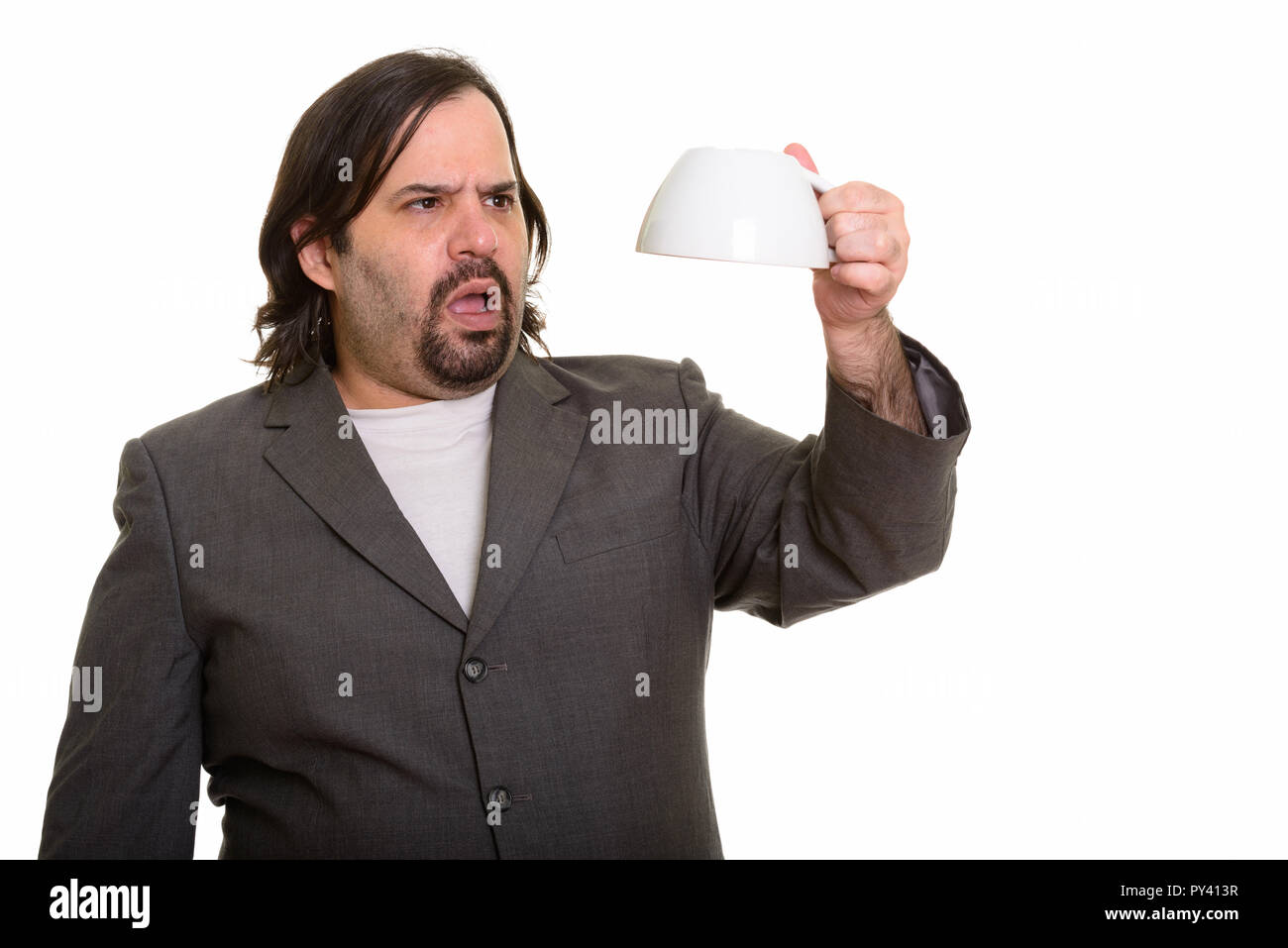 Fat Caucasian businessman holding empty Coffee cup Banque D'Images