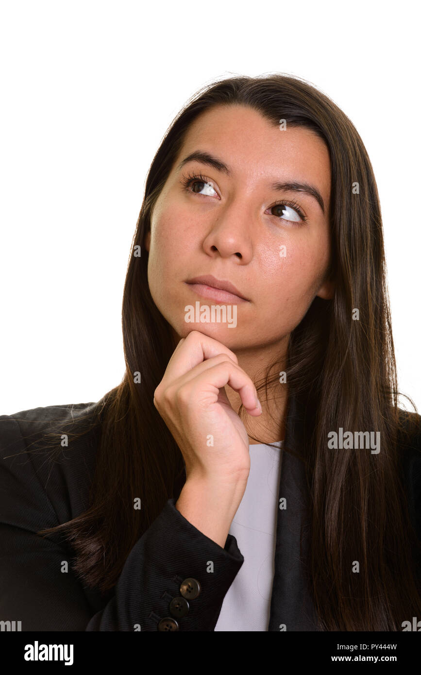 Young Caucasian businesswoman thinking et looking up Banque D'Images