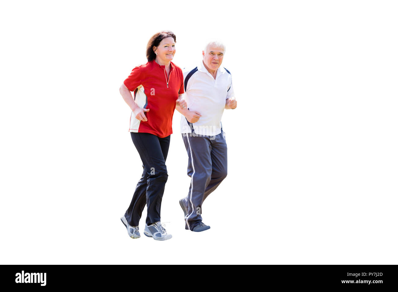 Portrait Of A Smiling Senior Couple Jogging sur fond blanc Banque D'Images