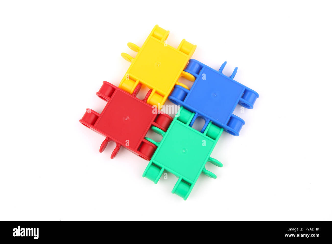 Quatre parties étroitement liées les unes aux autres pour symboliser le travail d'équipe Banque D'Images