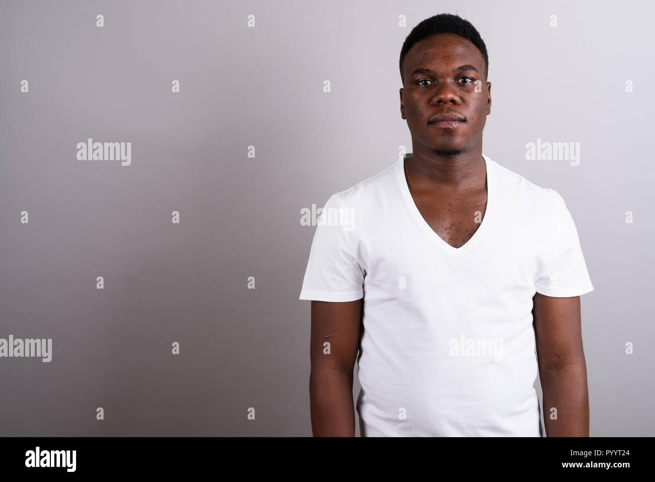 Portrait of young African man against white background Banque D'Images