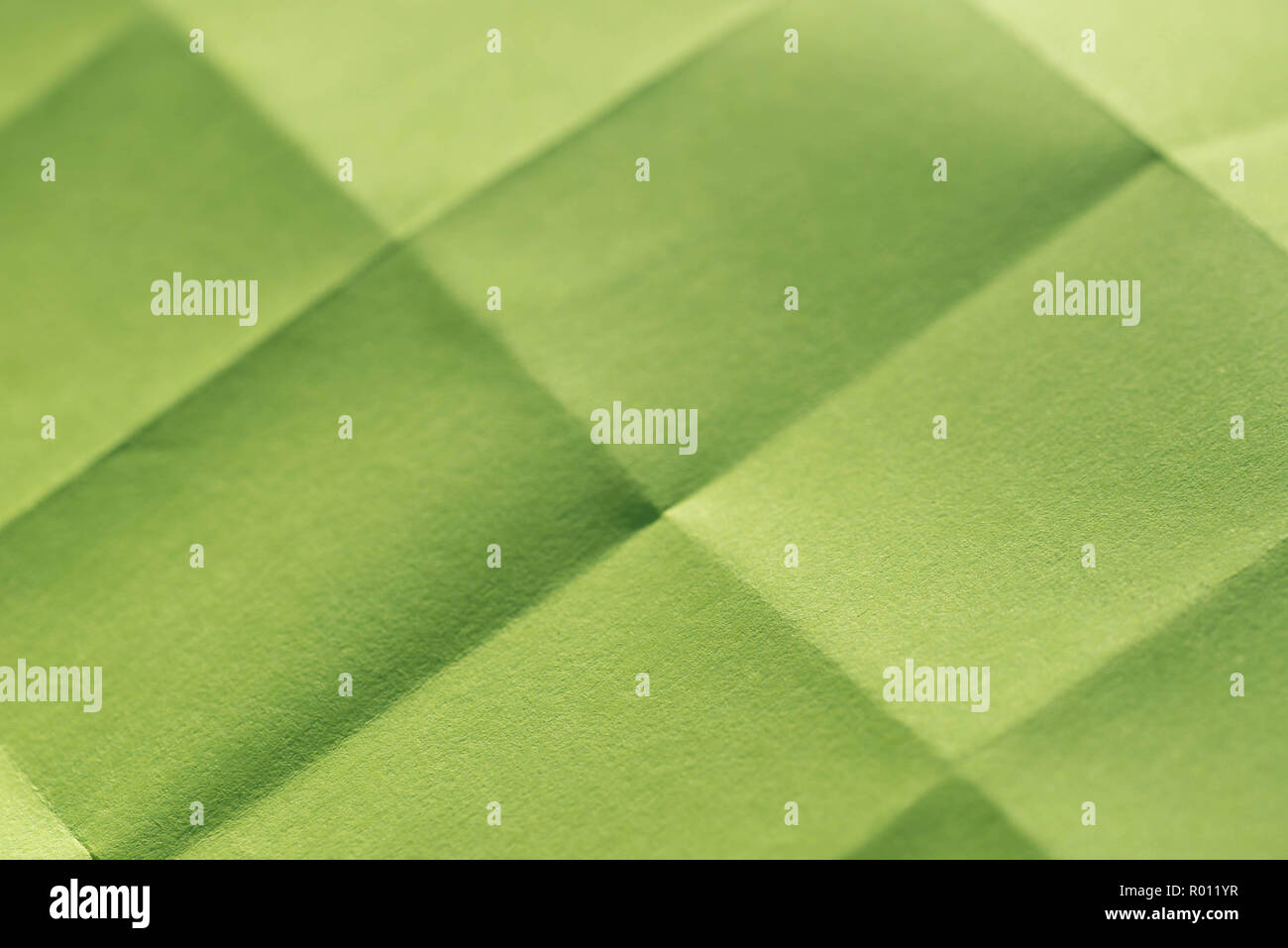 Feuille de papier vert texture de fond plié Banque D'Images