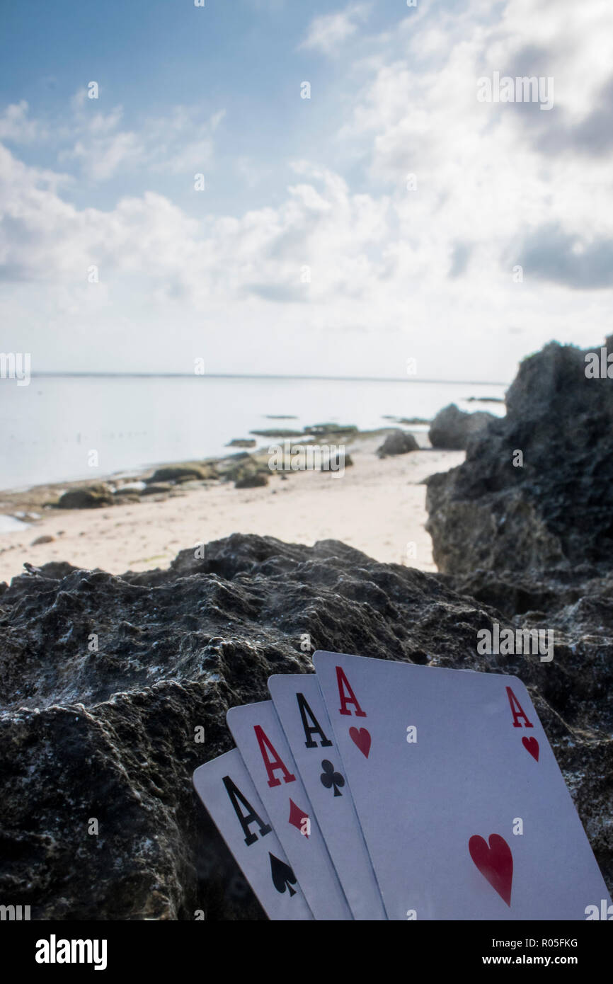 Quatre d'une sorte de carte ace poker gamble thème plage Banque D'Images