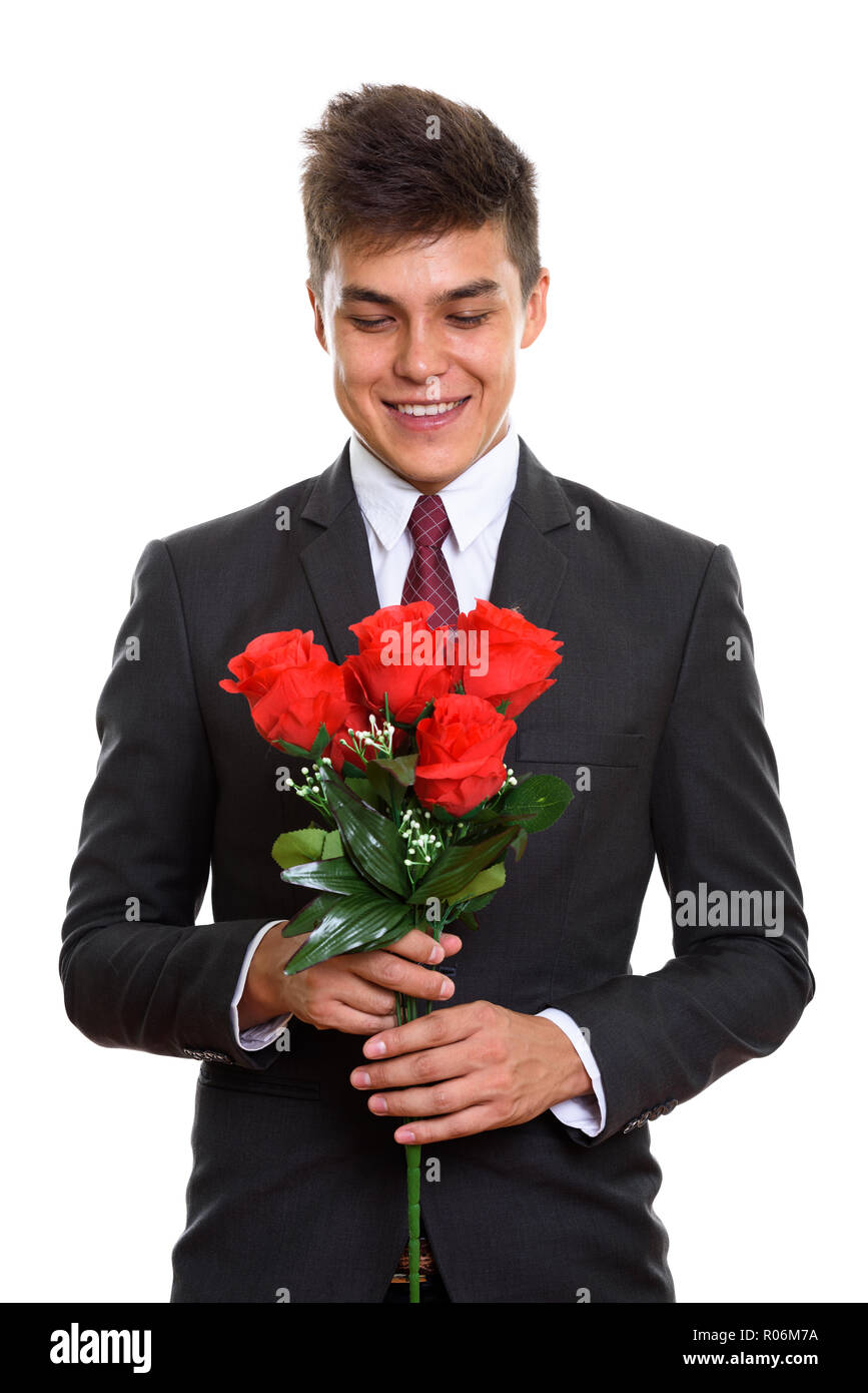 Young happy man tout en maintenant et à la recherche à Red Banque D'Images