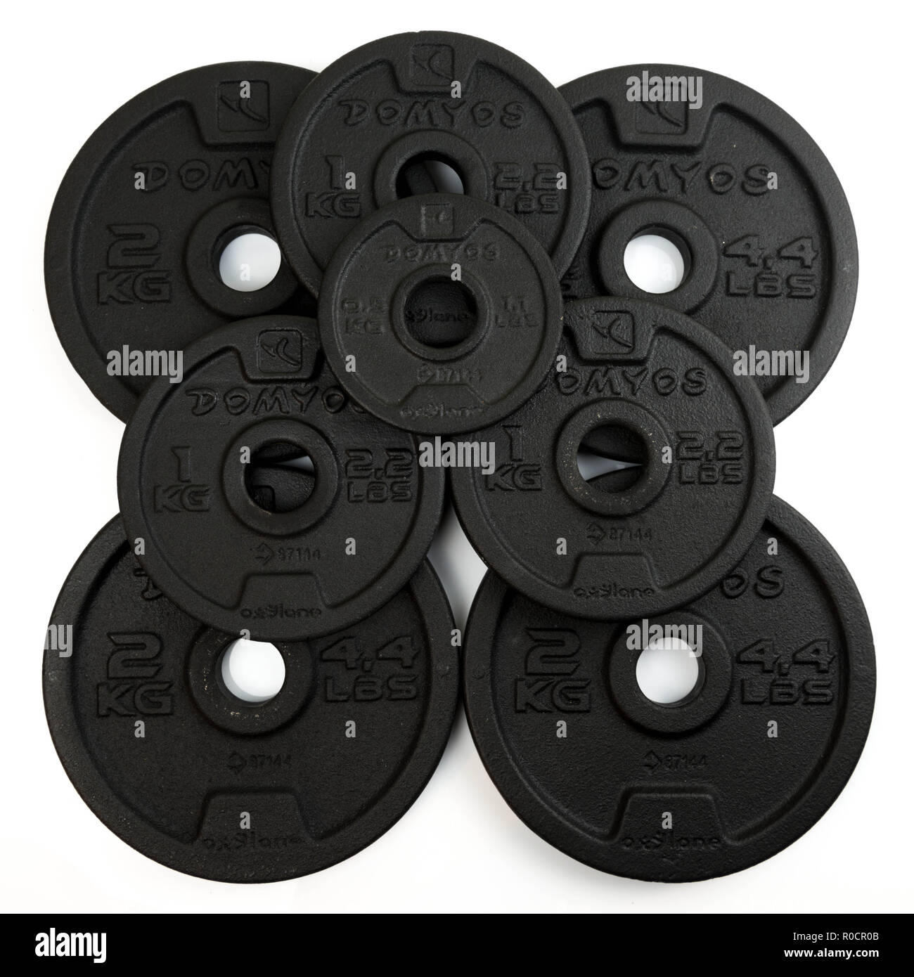 Poids en acier noir pour haltères courtes de la marque Domyos. la moitié,  l'une et deux kilogrammes de poids Photo Stock - Alamy