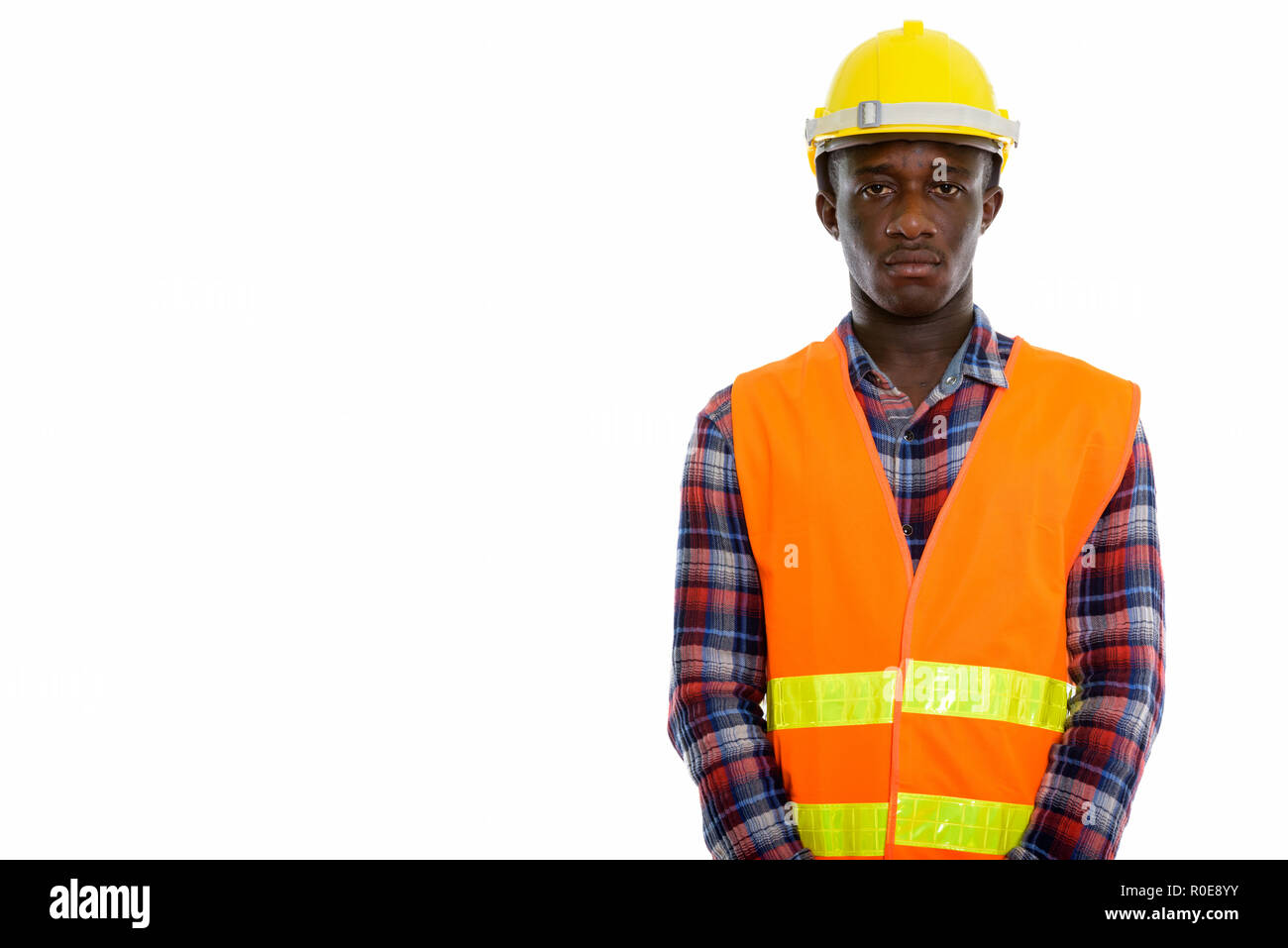 Studio shot of young black African man construction worker Banque D'Images