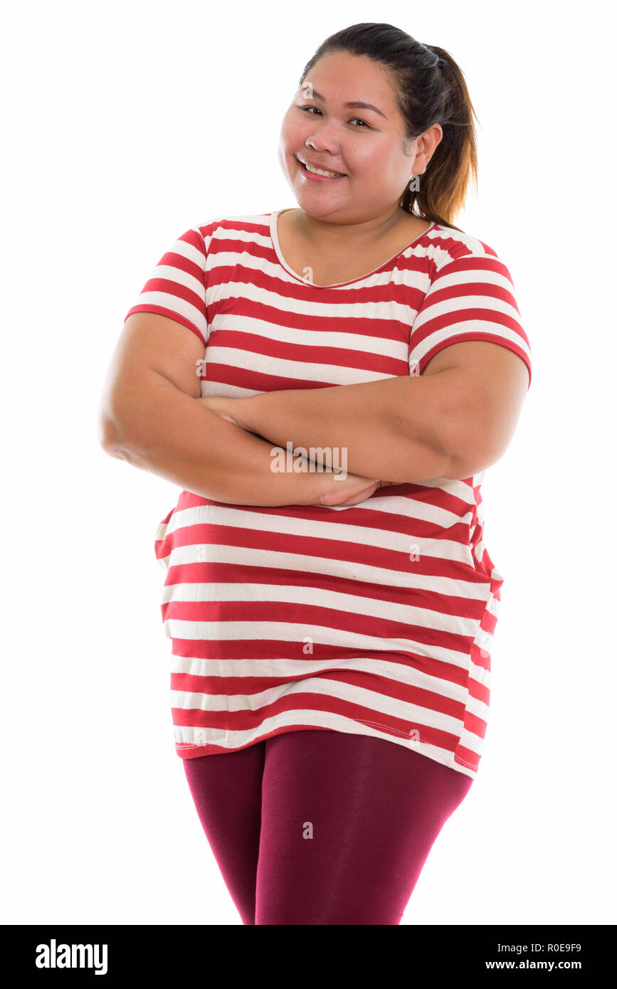 Studio shot of young happy fat woman kissing Banque D'Images