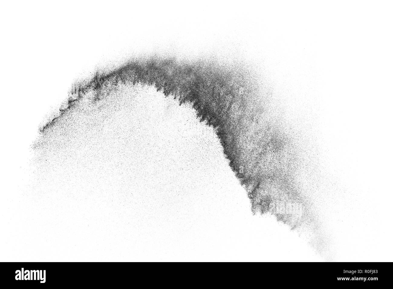 Explosion de particules noires isolé sur fond blanc. Résumé fond de poussière de texture. Banque D'Images