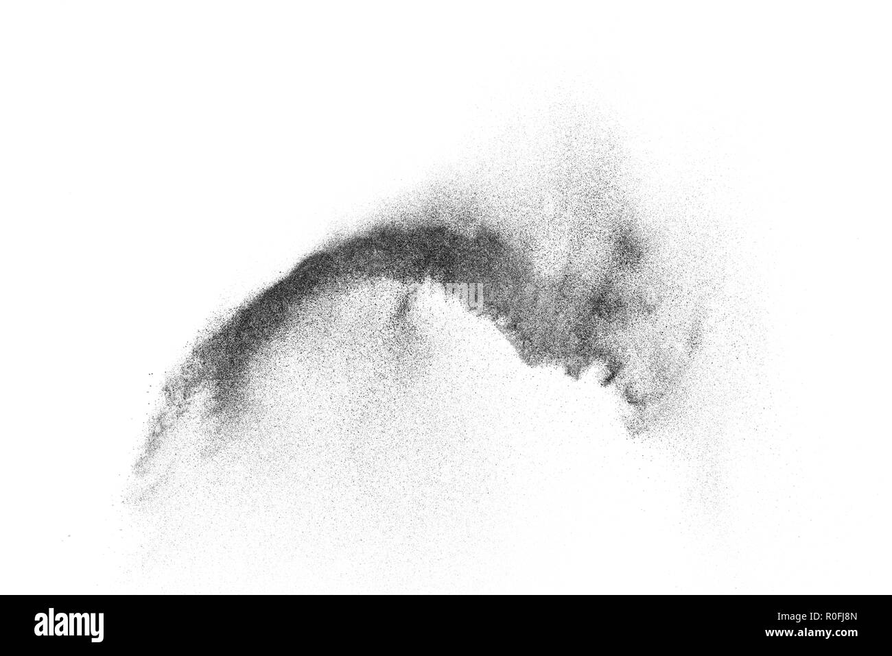 Explosion de particules noires isolé sur fond blanc. Résumé fond de poussière de texture. Banque D'Images