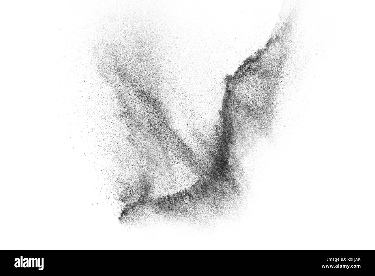 Explosion de particules noires isolé sur fond blanc. Résumé fond de poussière de texture. Banque D'Images