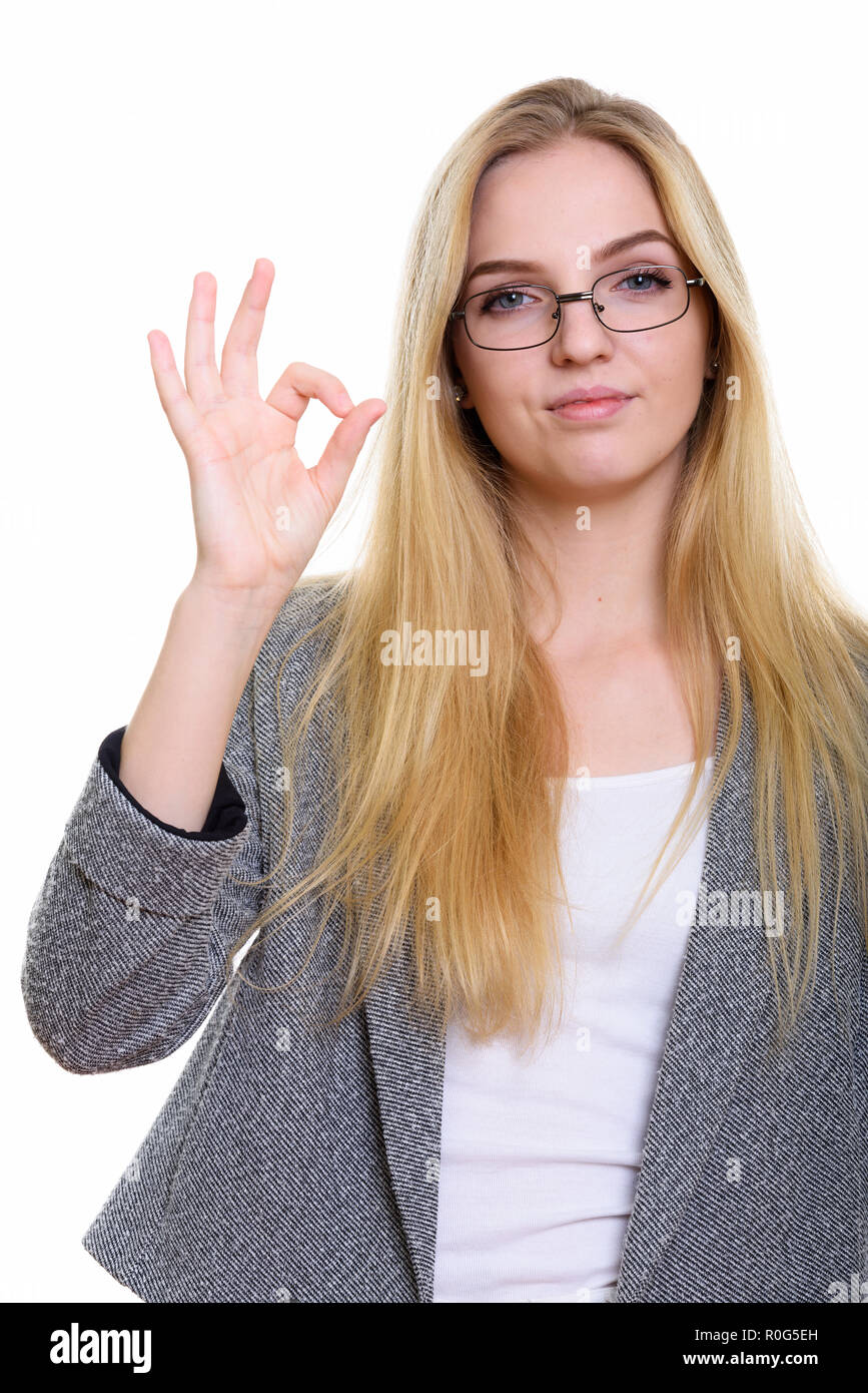 Studio shot of young beautiful businesswoman giving ok sign Banque D'Images