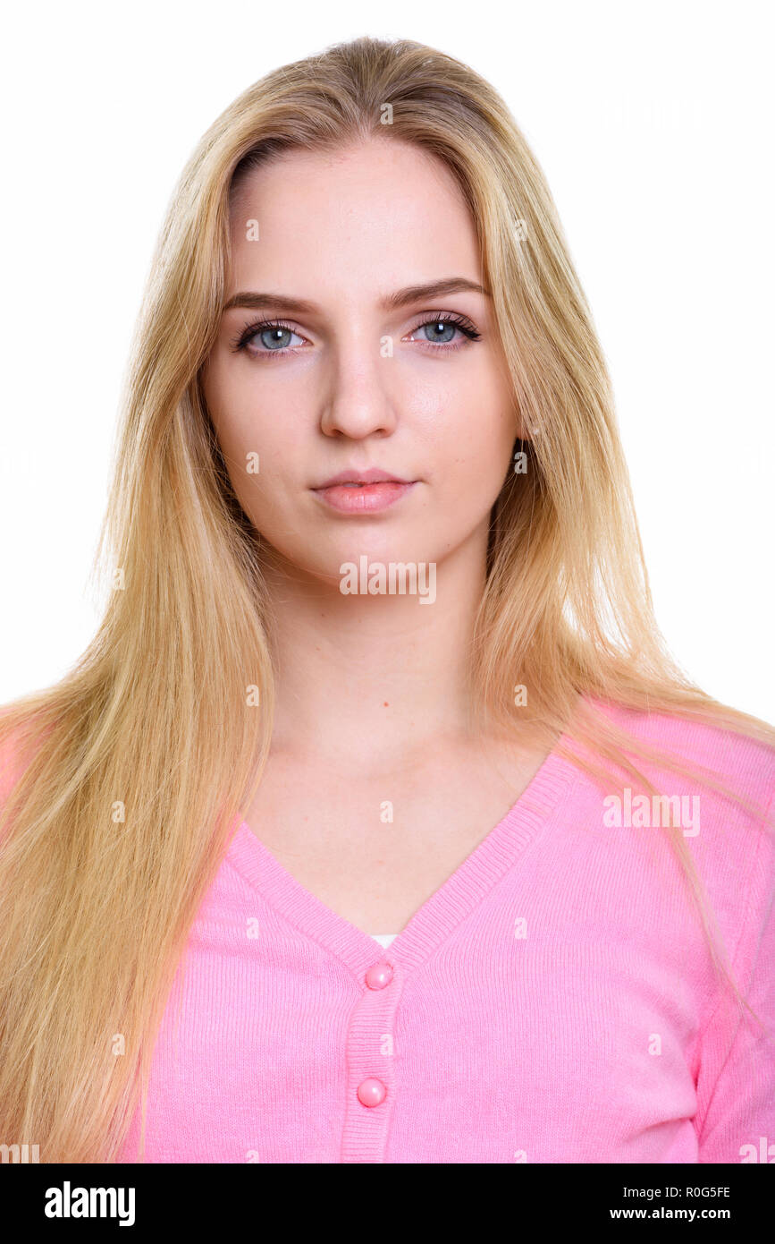 Face of young beautiful teenage girl wearing cardigan rose Banque D'Images