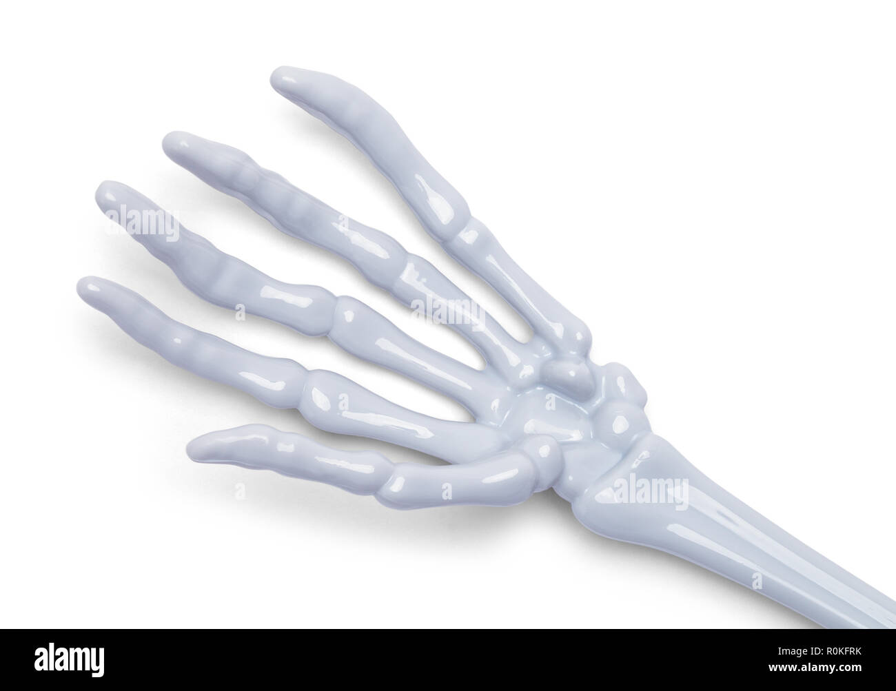 Ouvrir la main de squelette en plastique isolé sur un fond blanc. Banque D'Images