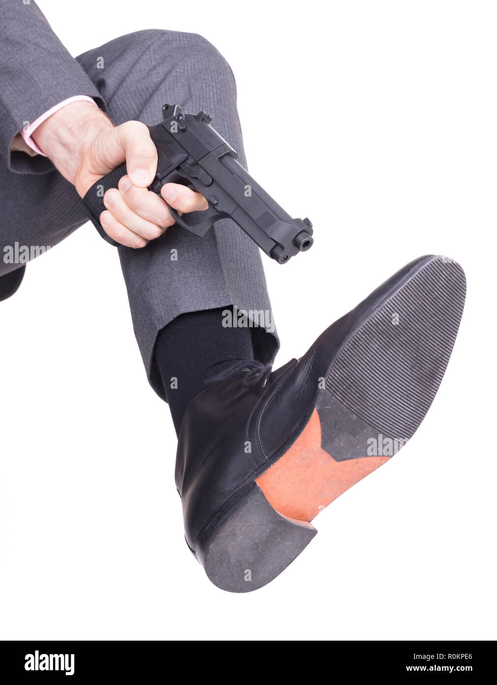 Concept d'affaires - tir une balle dans le pied avec un revolver Banque D'Images