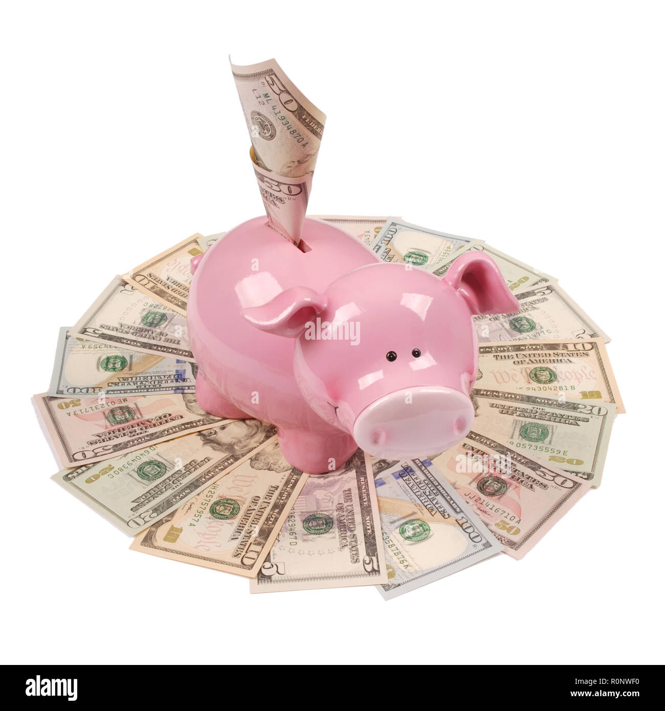 Pink piggy bank sur fonds blancs sur mandala kaleidoscope de l'argent. Résumé Contexte de l'argent trame répéter mandala circle. Banque D'Images