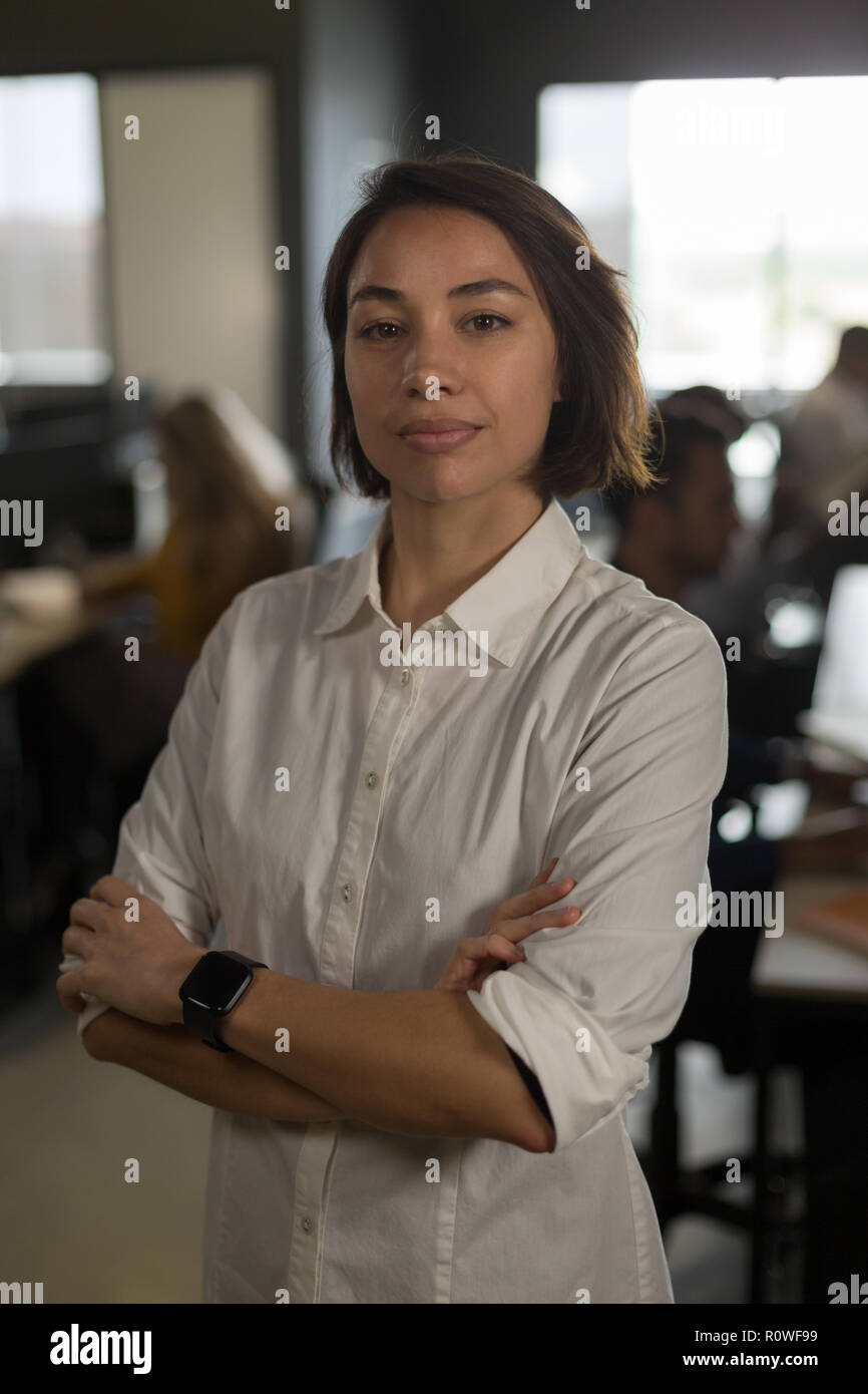 Female executive looking at camera in office Banque D'Images
