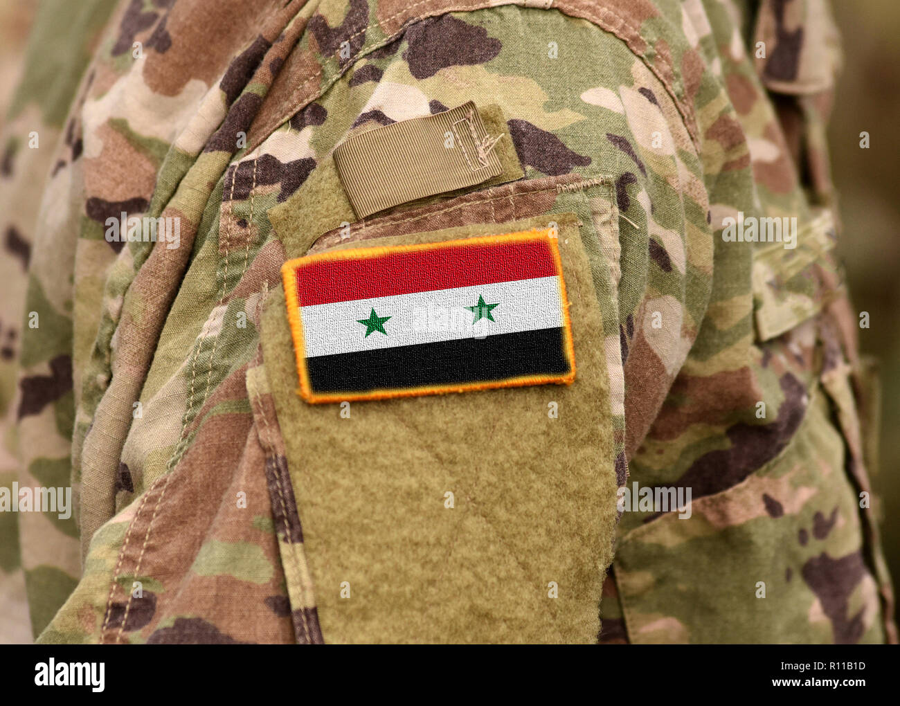Drapeau syrien sur les soldats du bras. L'armée de Syrie. Les troupes syriennes. Banque D'Images