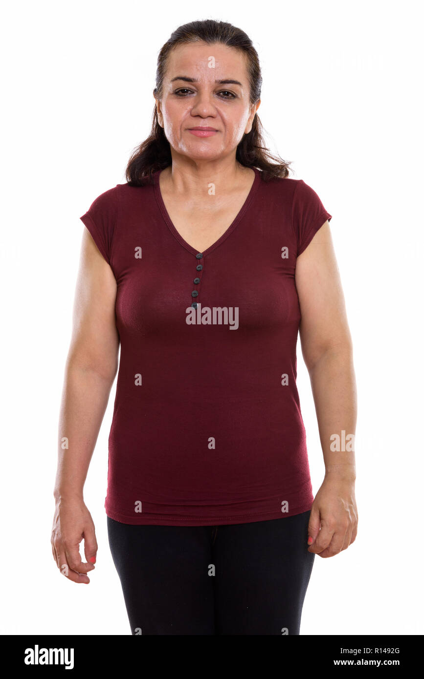 Studio shot of young woman standing persan Banque D'Images