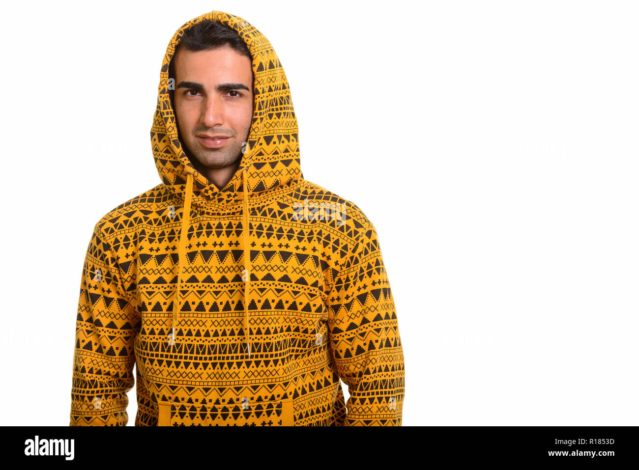 Portrait of young handsome man wearing hoodie persan Banque D'Images