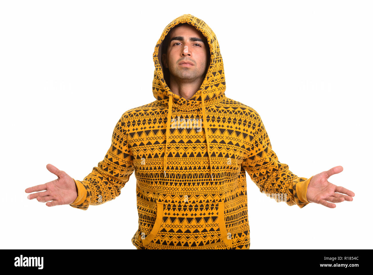 Portrait of young handsome man wearing hoodie persan Banque D'Images