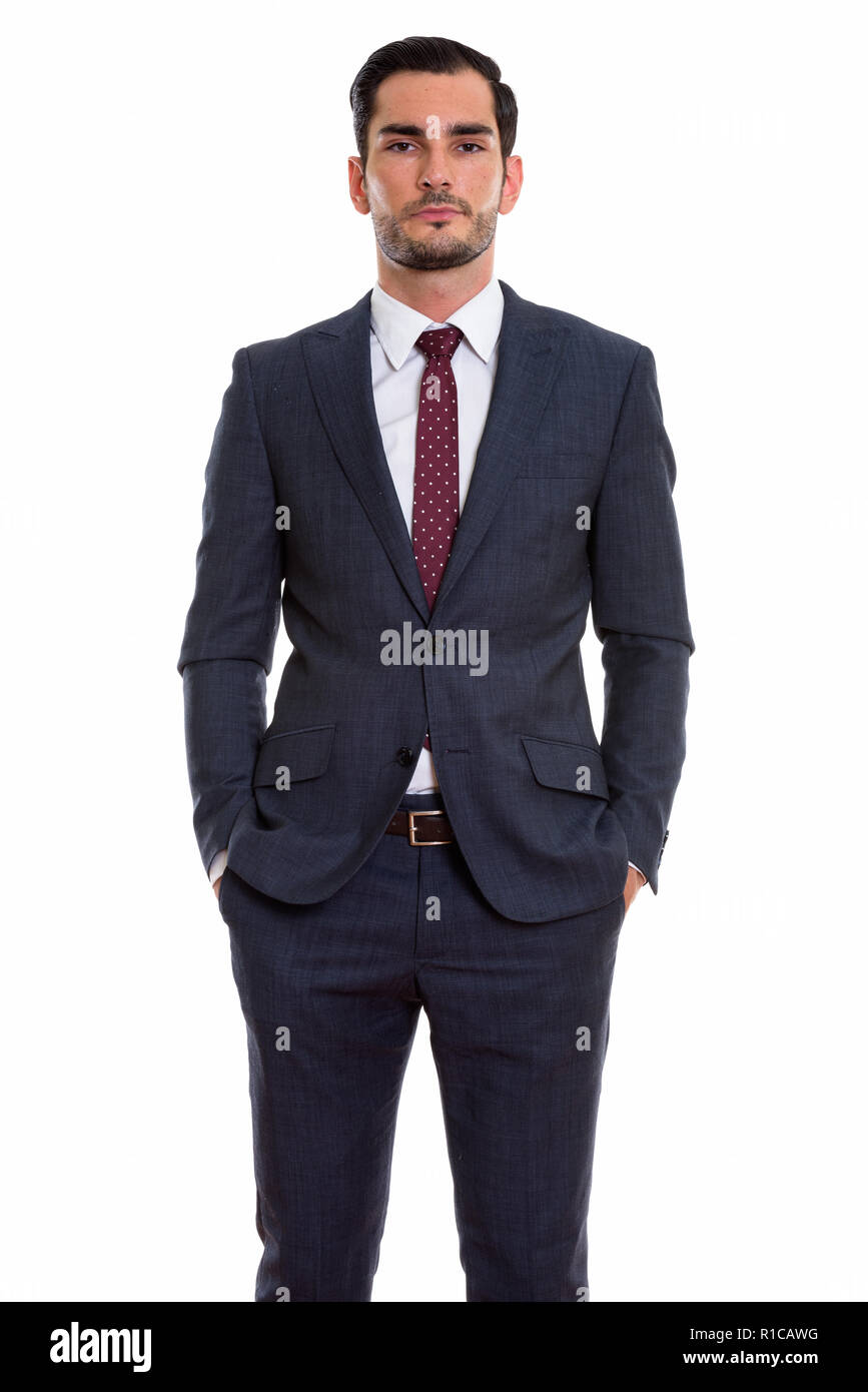 Studio shot of young handsome businessman standing Banque D'Images