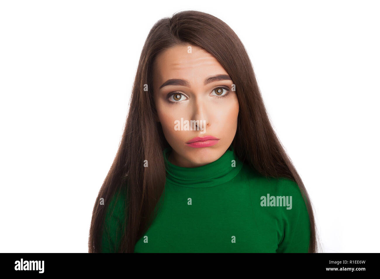 Femme dans un col roulé vert Banque D'Images