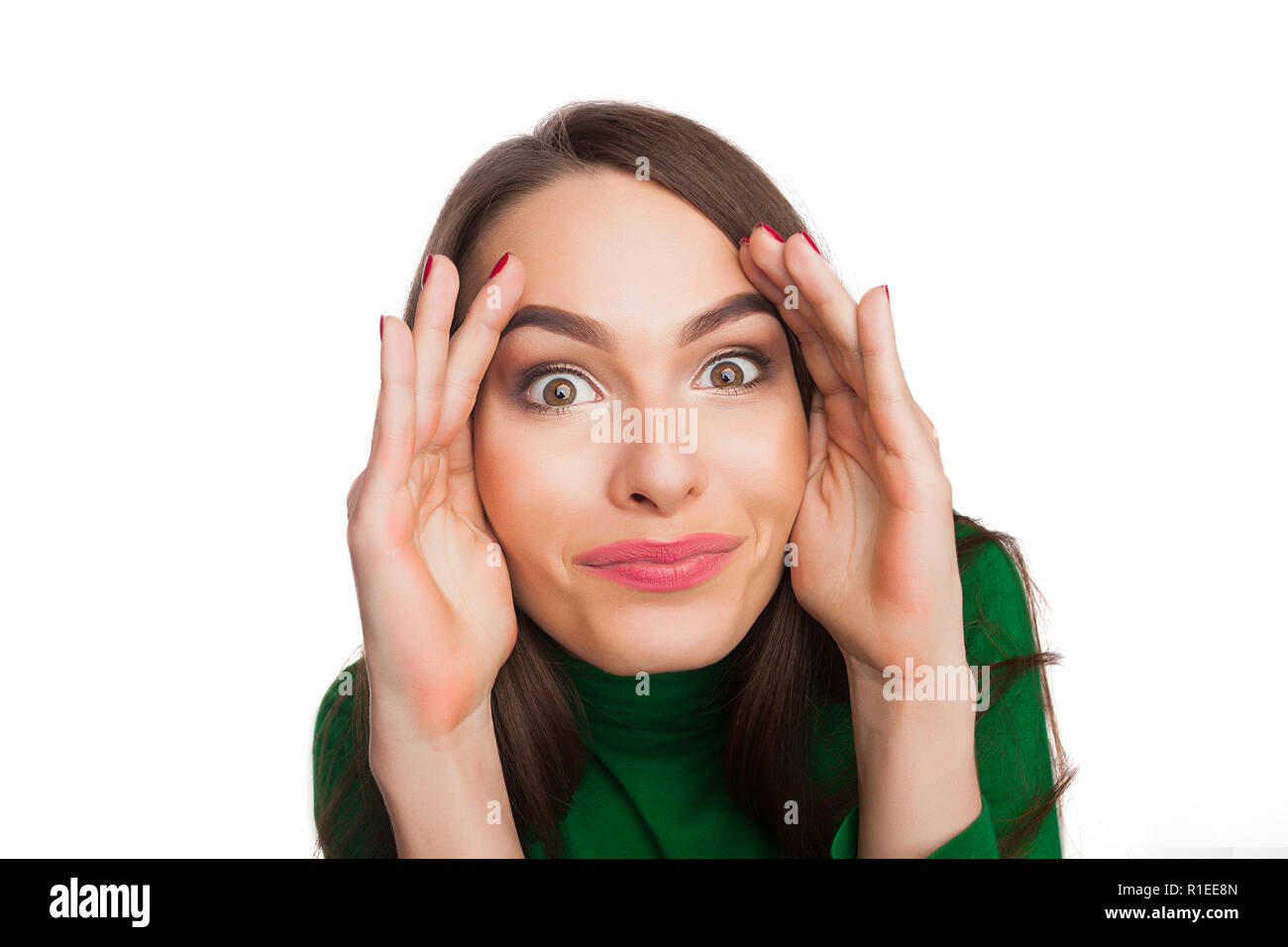 Femme dans un col roulé vert Banque D'Images