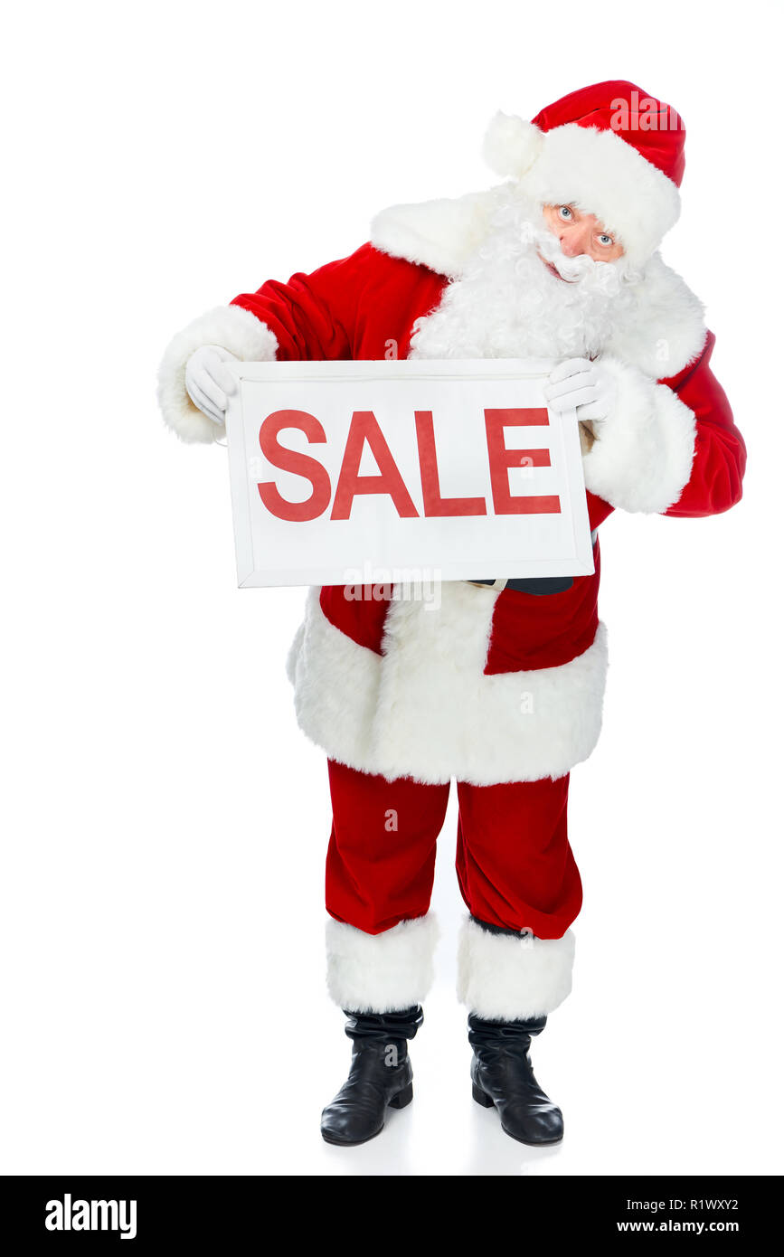 Le père Noël en rouge costume holding sale board isolated on white Banque D'Images