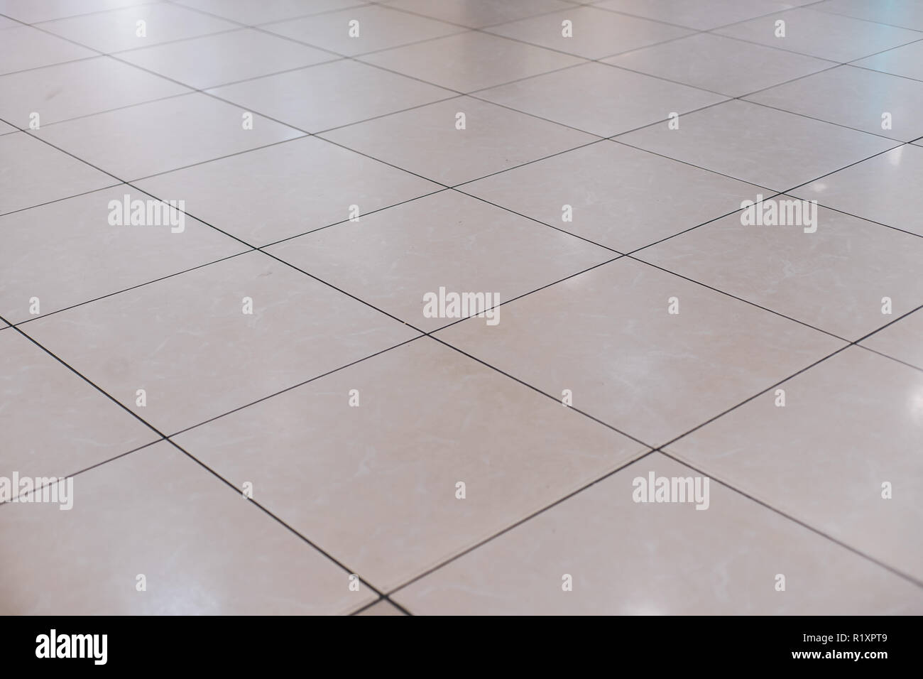 Carreaux beige sur le plancher en perspective Banque D'Images