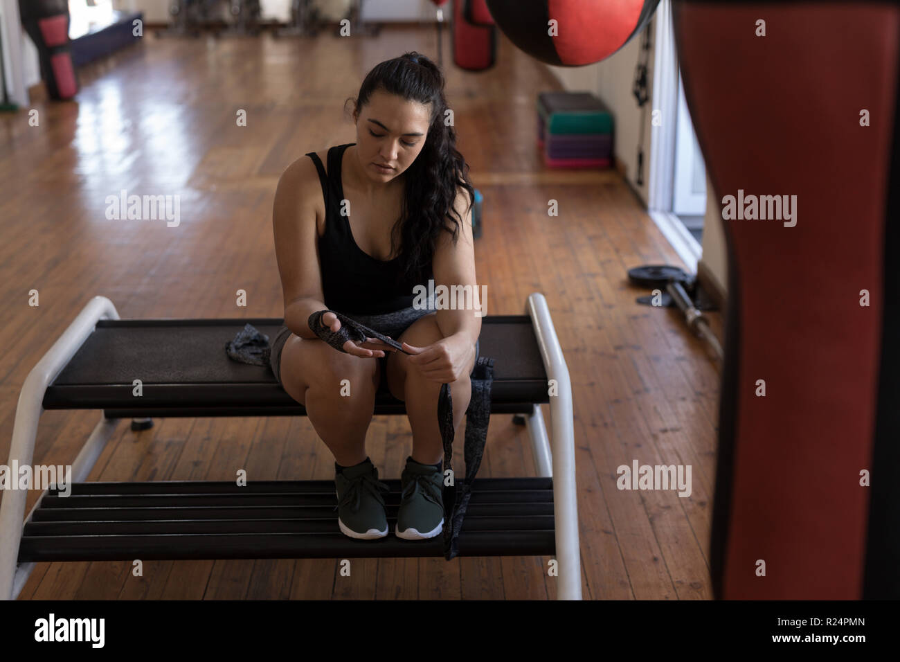 Boxer wearing part wrap in fitness studio Banque D'Images
