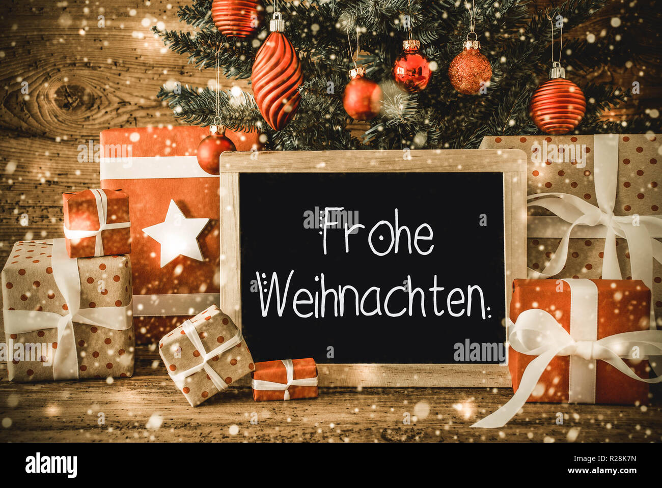 Tree, cadeaux, calligraphie Frohe Weihnachten signifie Joyeux Noël Banque D'Images