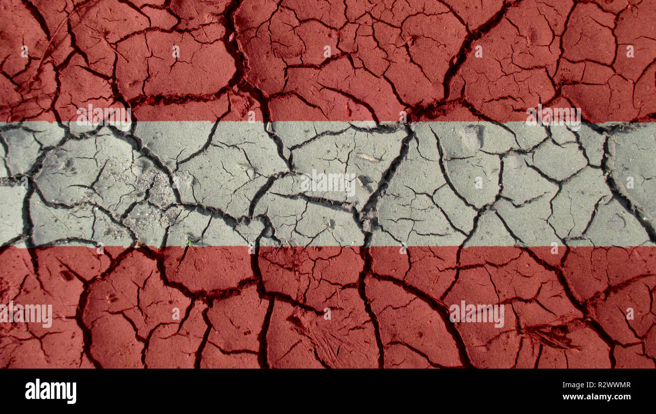 Crise politique ou de l'environnement Concept : fissures de boue avec drapeau Autriche Banque D'Images